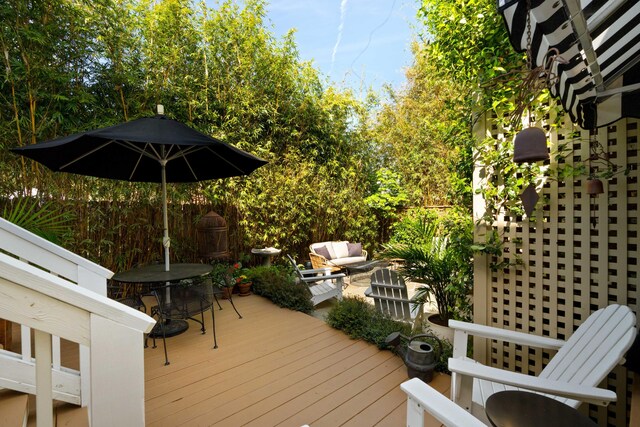 1012 Ashley Ave, Charleston, SC 29403 - wooden terrace featuring outdoor dining area, fence, and an outdoor living space