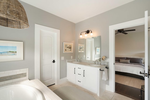 1012 Ashley Ave, Charleston, SC 29403 - bathroom featuring connected bathroom, ceiling fan, tile patterned flooring, and a sink
