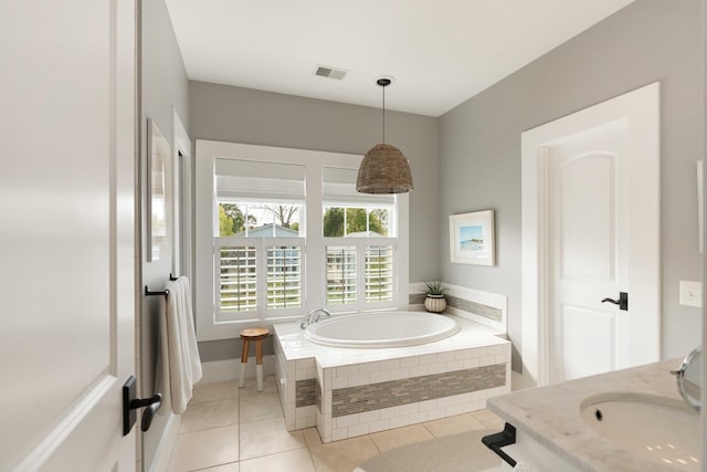 1012 Ashley Ave, Charleston, SC 29403 - bathroom featuring tile patterned flooring, a bath, visible vents, and a sink