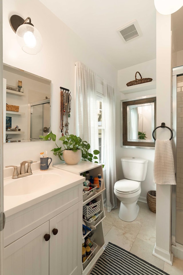 1012 Ashley Ave, Charleston, SC 29403 - bathroom featuring toilet, vanity, visible vents, and a stall shower