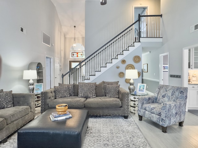 482 Planters Trace Dr, Charleston, SC 29412 - living room with a towering ceiling, stairway, and wood finished floors