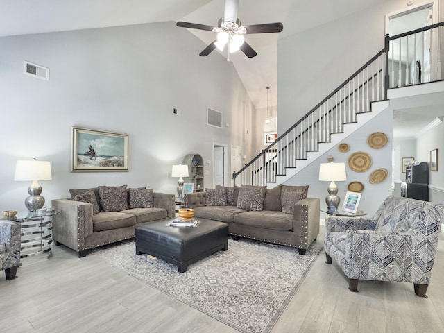 482 Planters Trace Dr, Charleston, SC 29412 - living room with high vaulted ceiling, wood finished floors, ceiling fan, and stairway