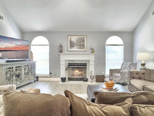 482 Planters Trace Dr, Charleston, SC 29412 - living room with lofted ceiling, wood finished floors, a fireplace, plenty of natural light, and baseboards