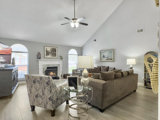 482 Planters Trace Dr, Charleston, SC 29412 - living room with high vaulted ceiling, ceiling fan, a lit fireplace, and light wood finished floors