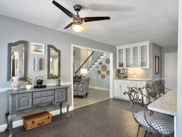 482 Planters Trace Dr, Charleston, SC 29412 - dining space featuring stairs, a ceiling fan, baseboards, and bar area