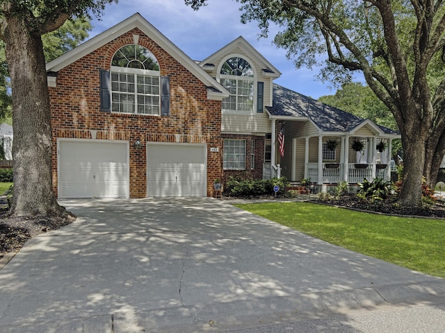 482 Planters Trace Dr, Charleston, SC 29412 - traditional home featuring brick siding, driveway, an attached garage, a front lawn, and a porch