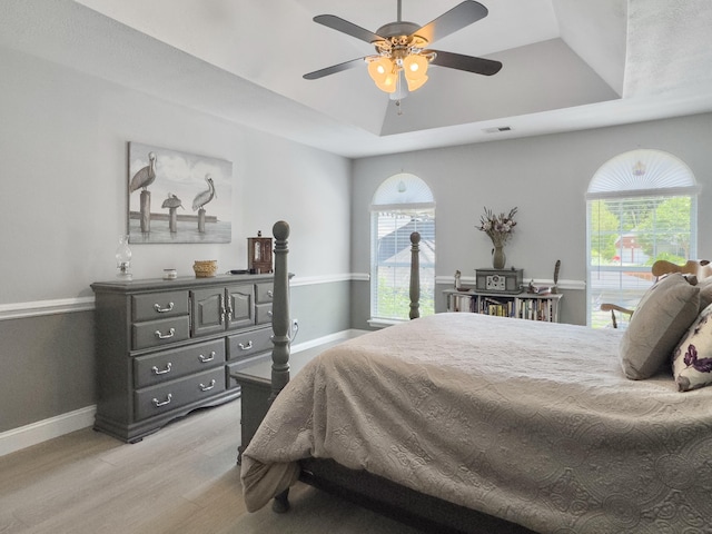 482 Planters Trace Dr, Charleston, SC 29412 - bedroom featuring a raised ceiling, light wood-style floors, baseboards, and ceiling fan