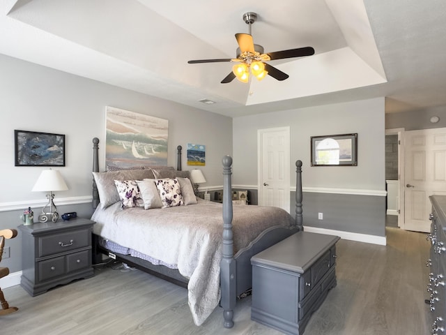 482 Planters Trace Dr, Charleston, SC 29412 - bedroom with a raised ceiling, wood finished floors, baseboards, and ceiling fan
