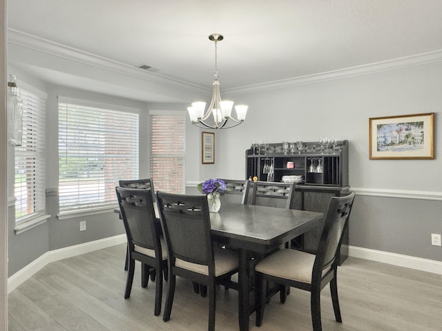 482 Planters Trace Dr, Charleston, SC 29412 - dining space with a chandelier, light wood-style floors, ornamental molding, and baseboards