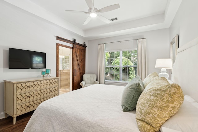 708 Lawton Harbor Dr, Charleston, SC 29412 - bedroom featuring a barn door, wood finished floors, a ceiling fan, and ensuite bathroom