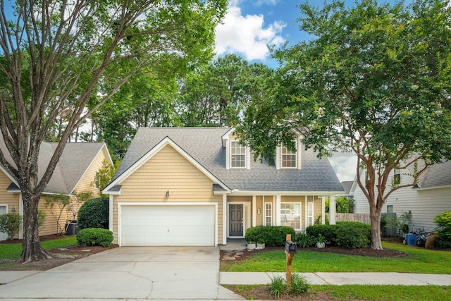 708 Lawton Harbor Dr, Charleston, SC 29412 - view of front of house featuring a garage, driveway, a shingled roof, and a porch