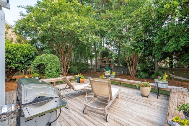 708 Lawton Harbor Dr, Charleston, SC 29412 - wooden terrace featuring a playground, a fenced backyard, a grill, and outdoor dining area