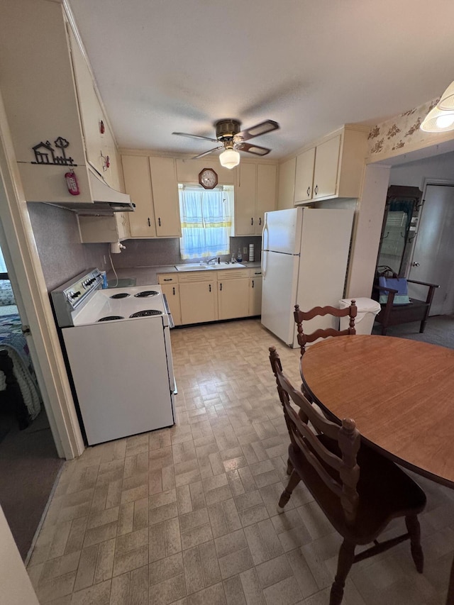 686 W Pine St, Varnville, SC 29944 - kitchen featuring white appliances, a ceiling fan, light countertops, and a sink