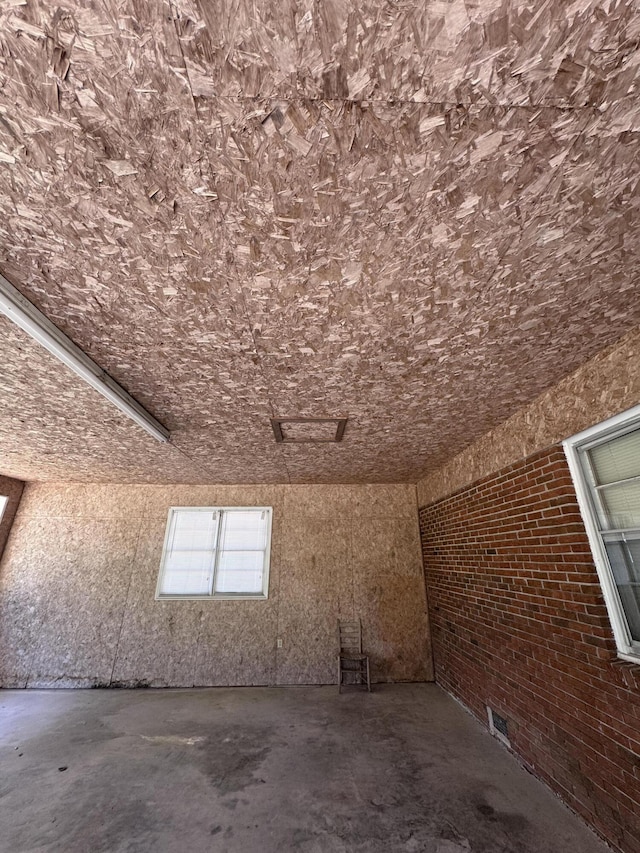 686 W Pine St, Varnville, SC 29944 - bonus room with brick wall and unfinished concrete flooring