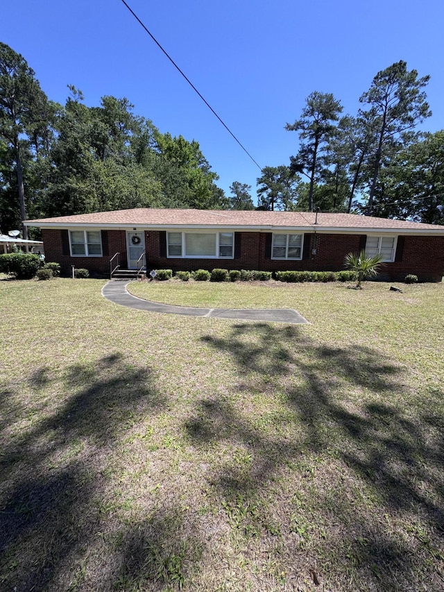 686 W Pine St, Varnville, SC 29944 - rear view of property featuring a yard and brick siding