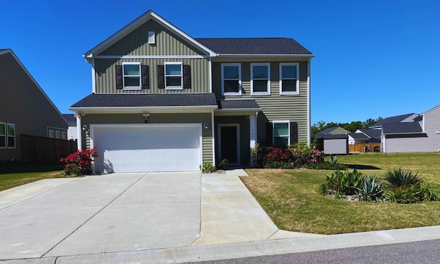 view of front of house featuring board and batten siding, an attached garage, a front lawn, and driveway