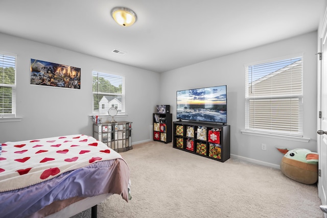 bedroom featuring carpet flooring and baseboards