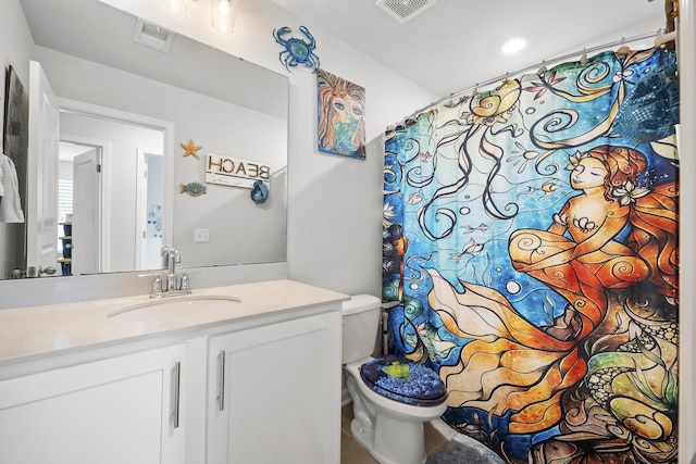 bathroom with vanity, toilet, and a shower with curtain