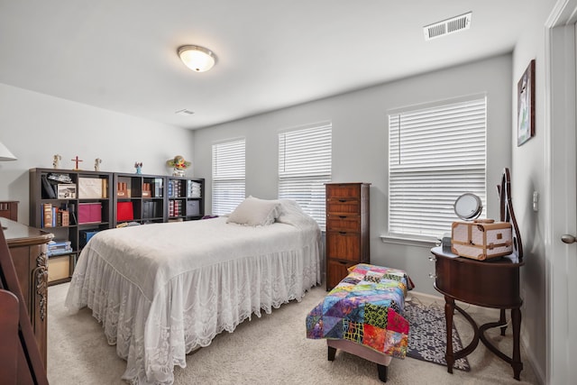 carpeted bedroom with baseboards