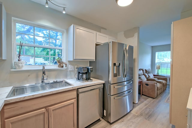 2538 Wayne Scott Ct, Charleston, SC 29414 - kitchen with stainless steel appliances, light wood-type flooring, light countertops, open floor plan, and white cabinetry