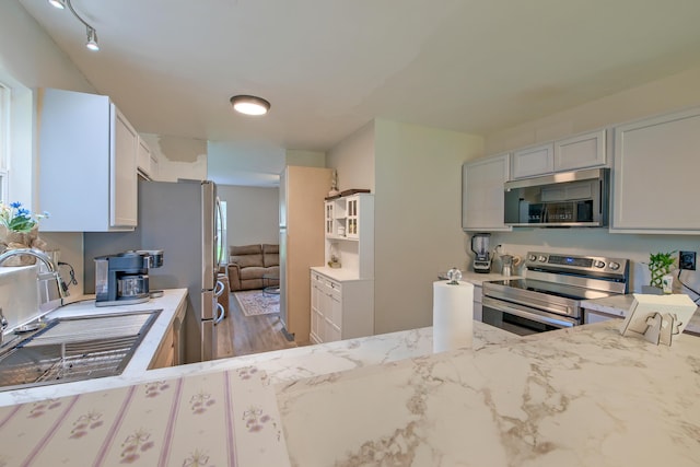 2538 Wayne Scott Ct, Charleston, SC 29414 - kitchen featuring stainless steel appliances, light stone countertops, and wood finished floors