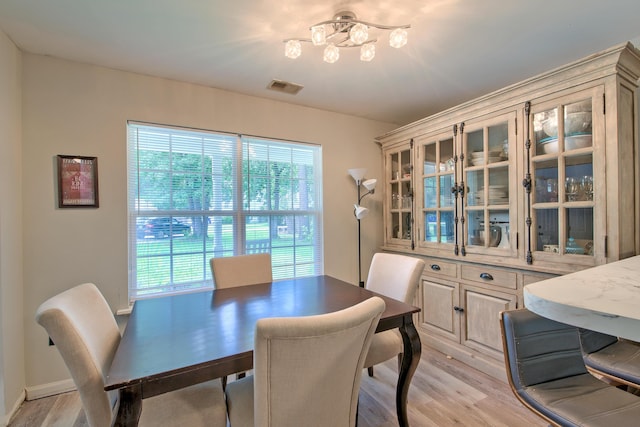 2538 Wayne Scott Ct, Charleston, SC 29414 - dining room with light wood-type flooring and a chandelier