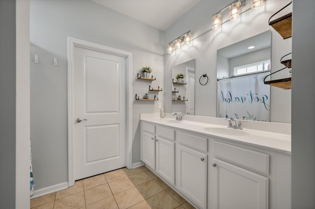 111 Nolin Rd, Moncks Corner, SC 29461 - bathroom featuring double vanity, tile patterned floors, baseboards, and a shower with curtain