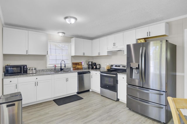 3428 Plaza Ln, North Charleston, SC 29420 - kitchen with stainless steel appliances, a sink, under cabinet range hood, white cabinetry, and a textured ceiling