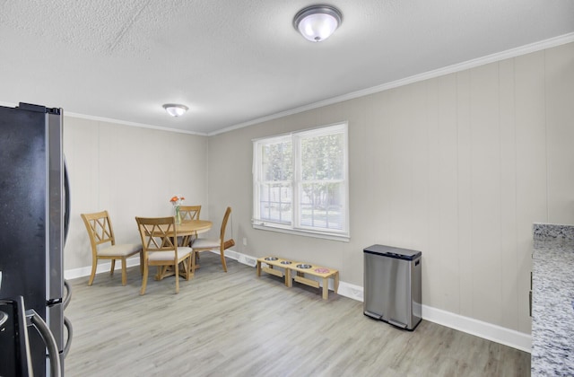 3428 Plaza Ln, North Charleston, SC 29420 - dining room featuring light wood-style flooring, crown molding, baseboards, and a textured ceiling
