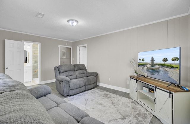 3428 Plaza Ln, North Charleston, SC 29420 - living area with wood finished floors, baseboards, and crown molding