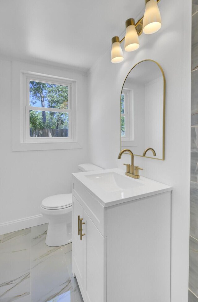 3428 Plaza Ln, North Charleston, SC 29420 - bathroom featuring vanity, plenty of natural light, toilet, and baseboards