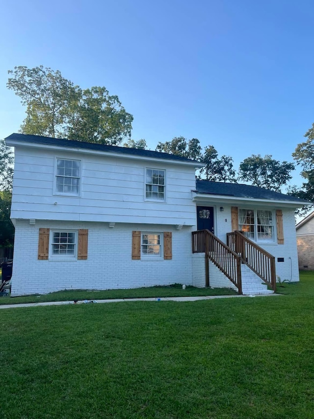 3428 Plaza Ln, North Charleston, SC 29420 - tri-level home with brick siding and a front lawn