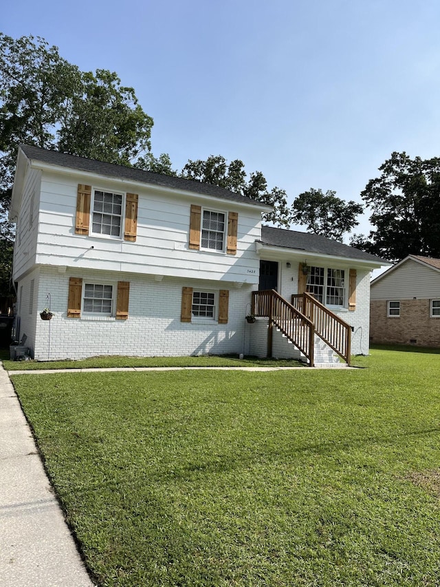 3428 Plaza Ln, North Charleston, SC 29420 - tri-level home with brick siding and a front lawn
