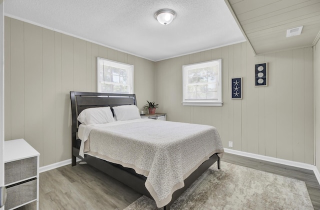 3428 Plaza Ln, North Charleston, SC 29420 - bedroom with wood finished floors, crown molding, and baseboards