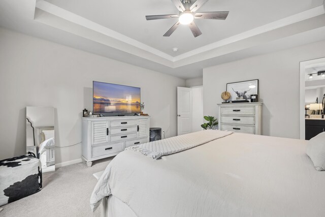 1387 Thin Pine Dr, Johns Island, SC 29455 - bedroom with light colored carpet, a tray ceiling, baseboards, a ceiling fan, and ensuite bath