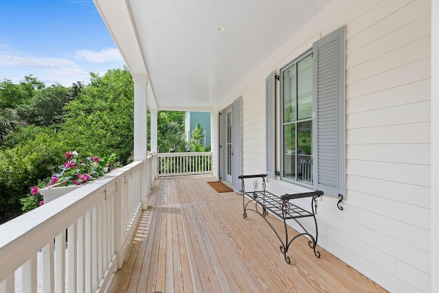 wooden terrace with a porch