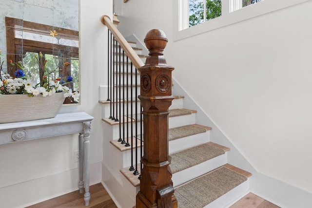 staircase featuring wood finished floors