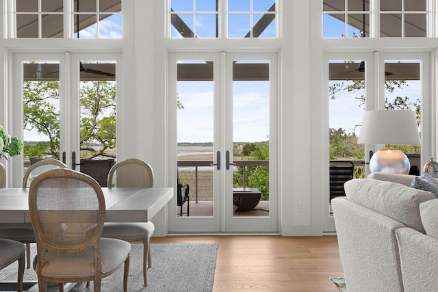doorway to outside with light wood-style floors and french doors