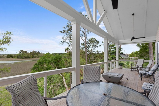 deck featuring ceiling fan and outdoor dining space