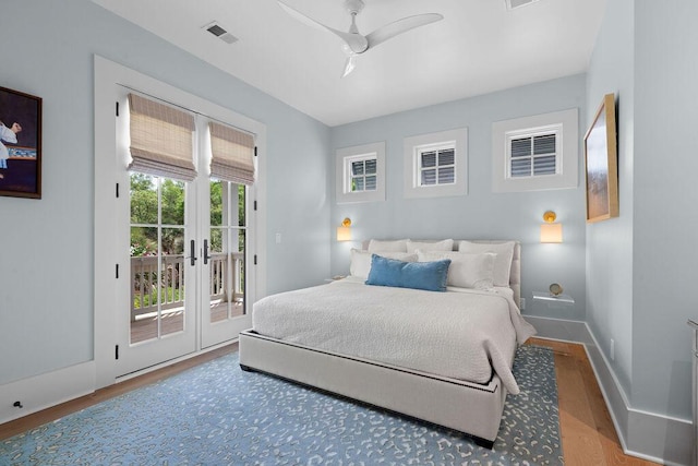 bedroom with french doors, a ceiling fan, wood finished floors, visible vents, and access to outside