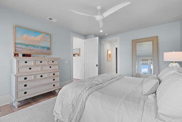 bedroom with dark wood-type flooring, baseboards, visible vents, ceiling fan, and recessed lighting