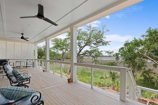 wooden deck featuring ceiling fan