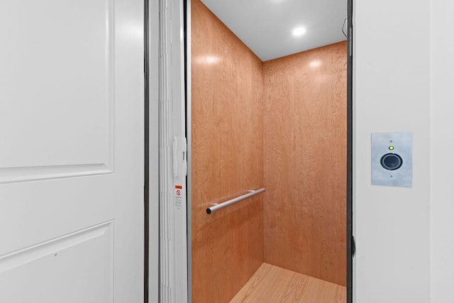 room details with elevator and recessed lighting