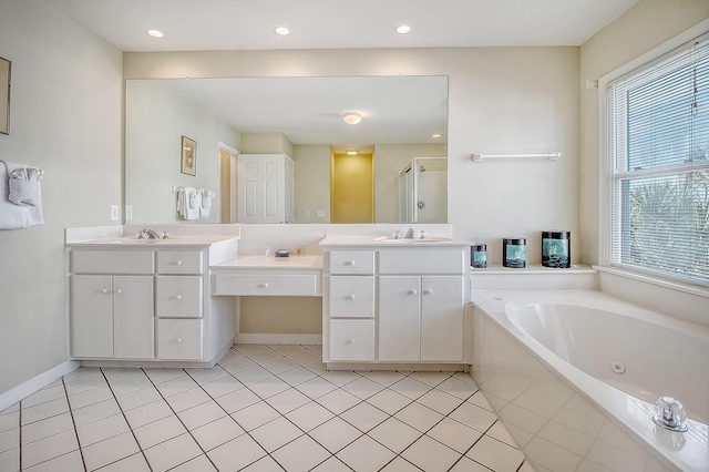 bathroom with tile patterned flooring, shower with separate bathtub, and vanity