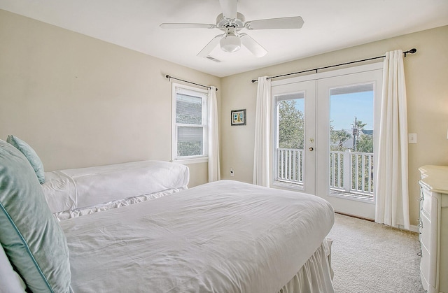 carpeted bedroom featuring access to exterior, french doors, and ceiling fan