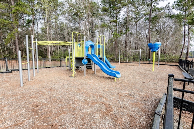 communal playground featuring fence