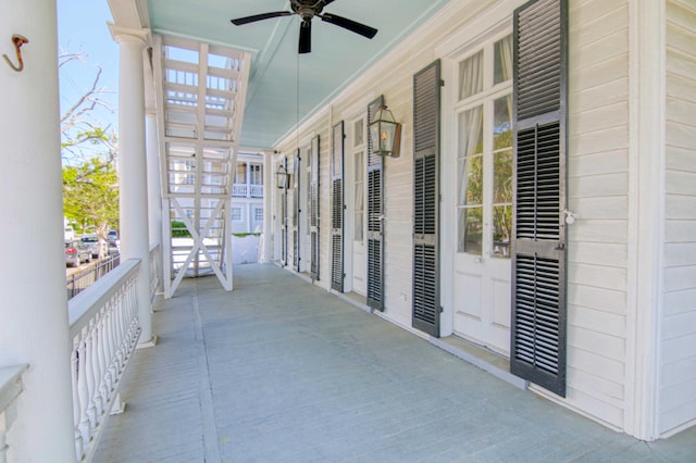 view of patio / terrace with ceiling fan and a porch