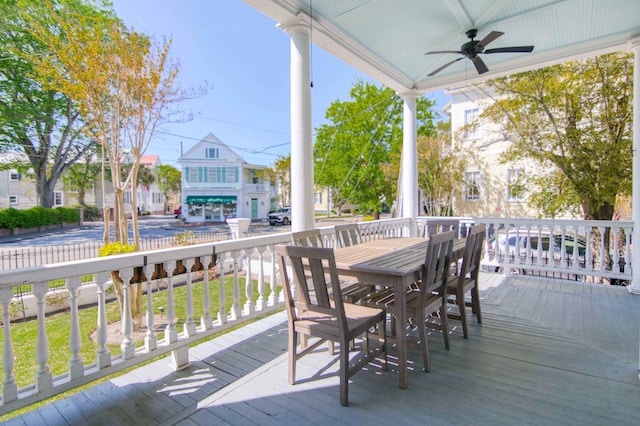 wooden terrace featuring ceiling fan