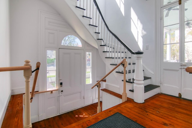 entryway with hardwood / wood-style floors