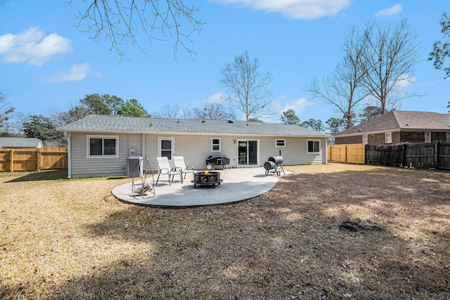 back of house featuring a fire pit and a patio
